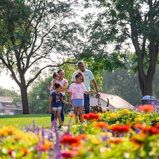 Family enjoying the beautiful blossoms in a Sioux Falls park