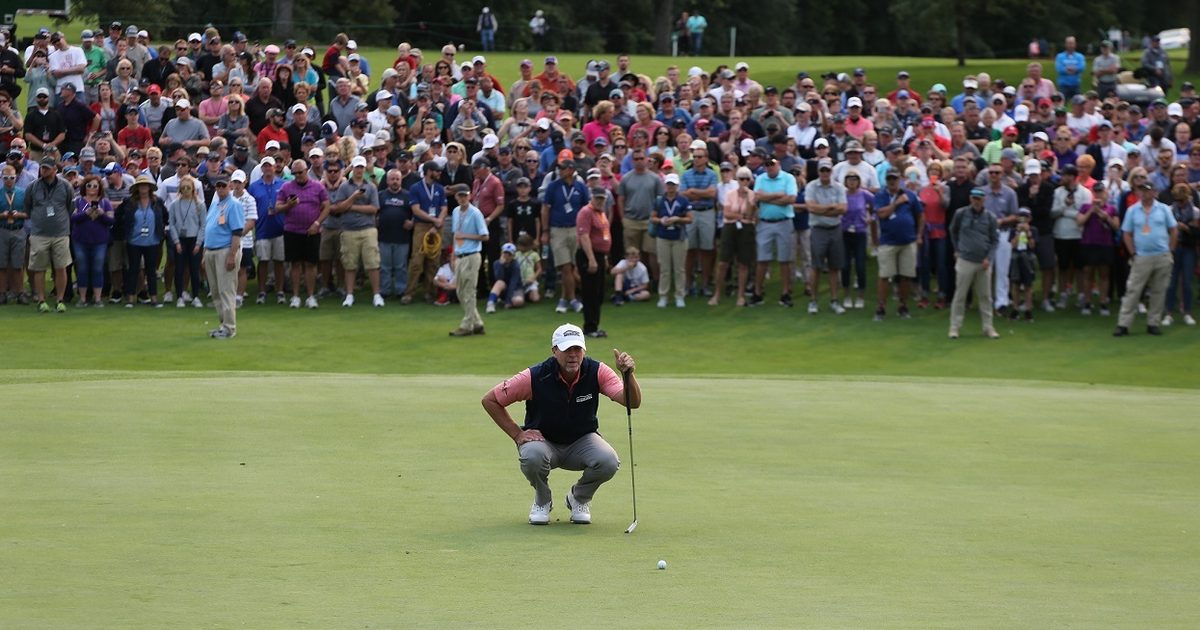 Golfer checkout out their shot during the Sanford International