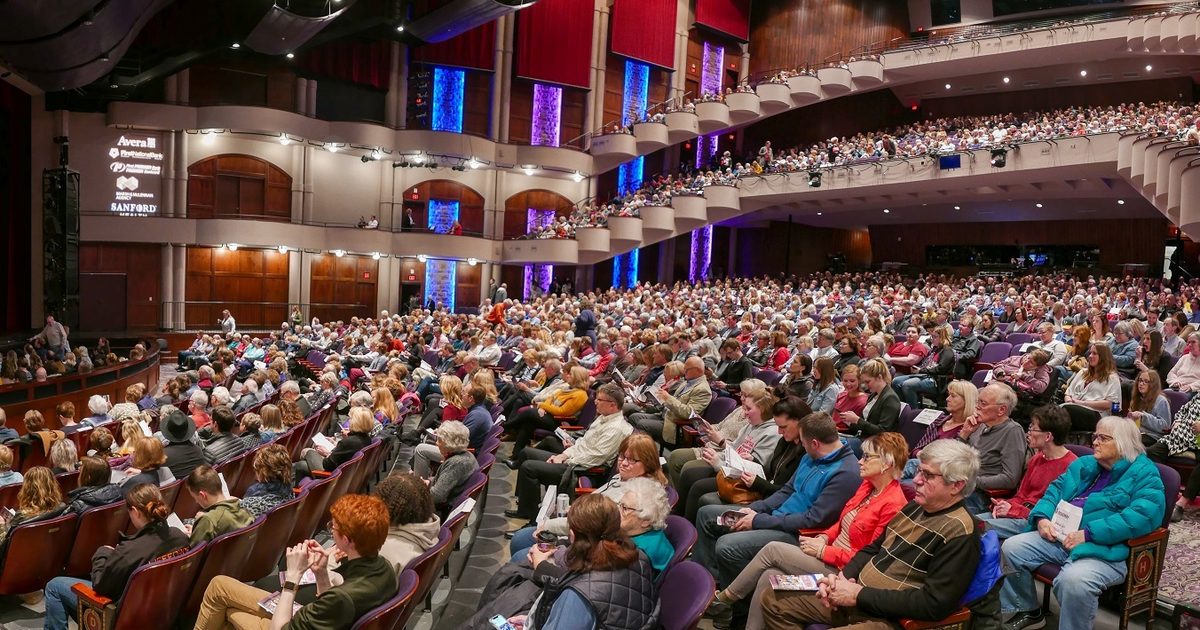 People attending a show at the Washington Pavilion Theater