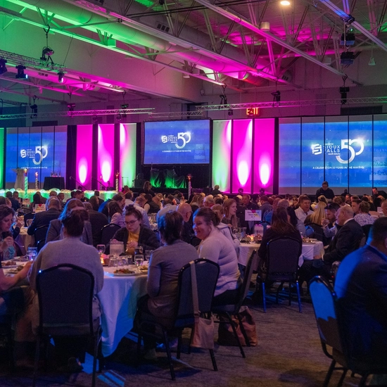People chatting at tables during the Visitor Industry Luncheon